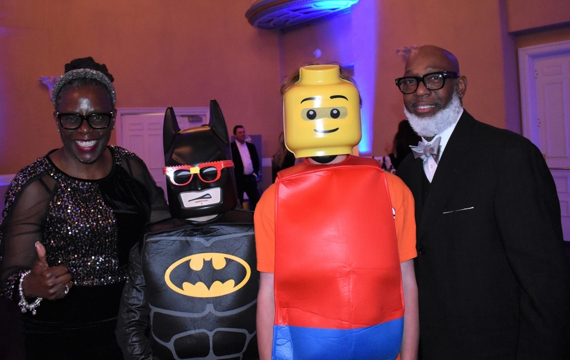 Two people with Batman and LEGO Man